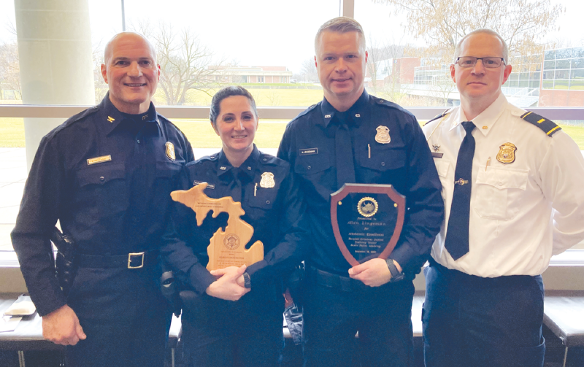  At left, Grosse Pointe Shores Public Safety Director Kenneth Werenski and, at right, Lt. Tony Spina congratulate new Shores officers Celeste Harrington and Allen Lingeman after both graduated from the Macomb Police Academy with honors in December 2023. 