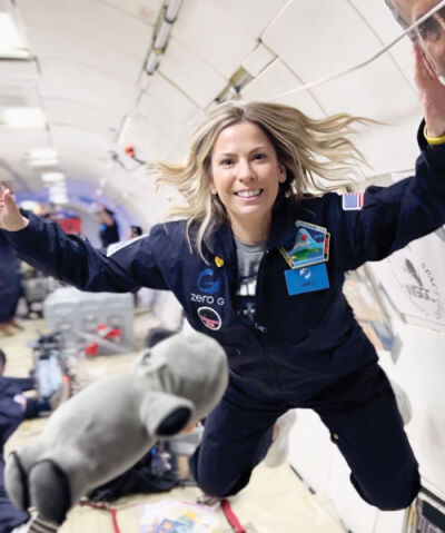  Using a specially designed cargo plane flying in parabolic arcs, passengers like Larson Middle School teacher Colleen Cain, pictured, can experience zero gravity. 