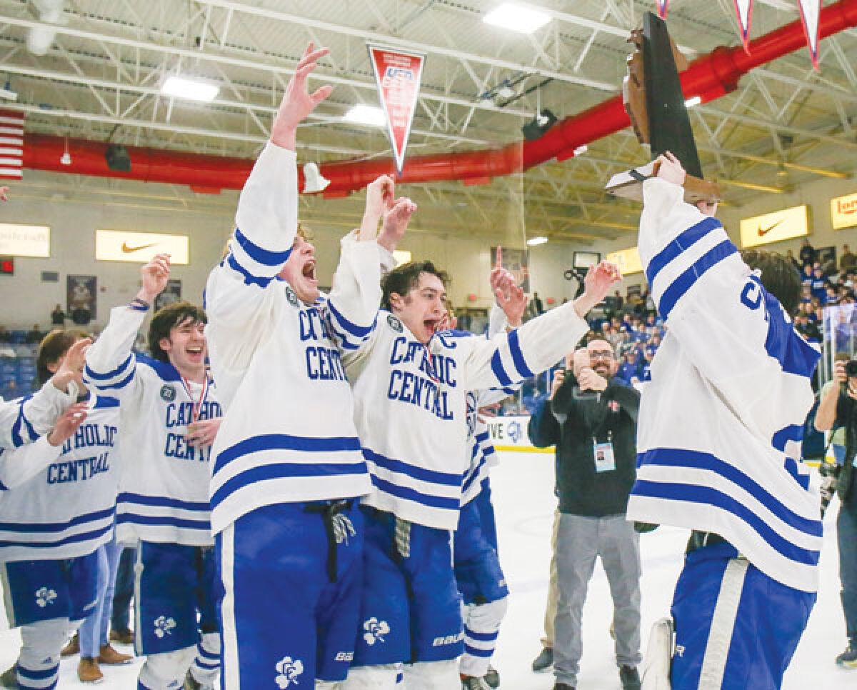  Detroit Catholic Central celebrates its fifth-consecutive Michigan High School Athletic Association Division 1 state championship win after a 2-0 victory over Brighton March 9 at the USA Hockey Arena in Plymouth. 
