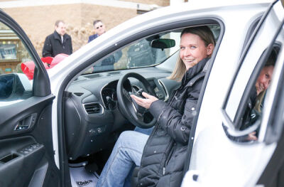  Stewart sits in the new Chevrolet Equinox she was gifted for two years by Feldman Automotive. 