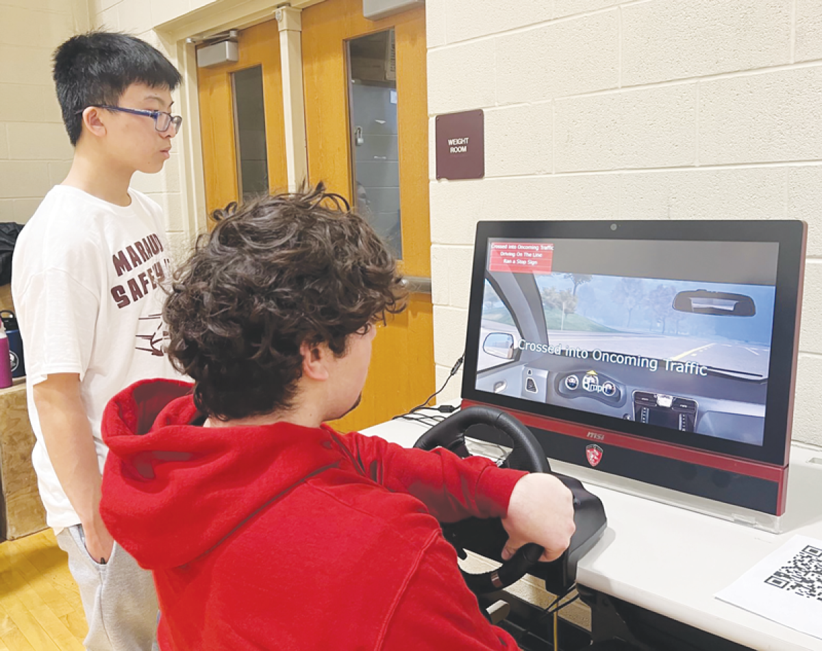  Warren Mott High School students used a safety driving simulator to see the effects of impaired driving while distracted behind the wheel.  