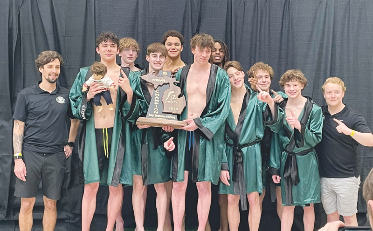  Birmingham Groves swim and dive celebrates its second-straight MHSAA Division 2 state title March 9 at Eastern Michigan University.  