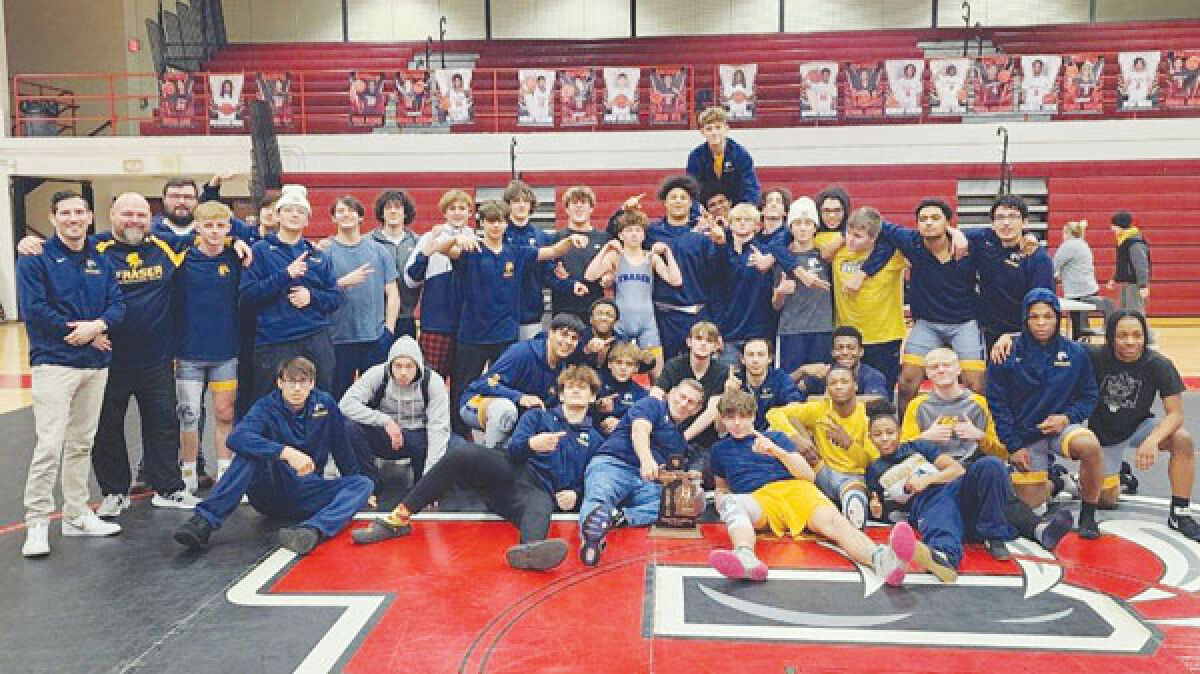  Fraser wrestling celebrates a team district championship win after defeating Roseville and Sterling Heights on Feb. 7 at Roseville High School. 