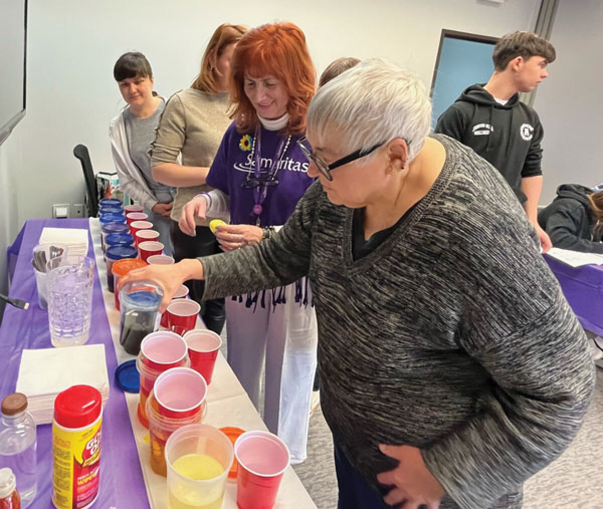  Pysanka expert Luba Petrusha walks Ukrainian Americans through the process of creating a pysanka egg at the Samaritas center in Troy. 