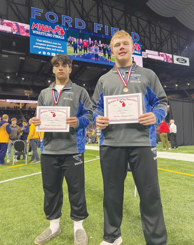  Rochester senior Damian Ybarra, left, and junior Jack Lower earned all-state honors March 2 at the Michigan High School Athletic Association Division 1 Individual Wrestling State Finals at Ford Field. 