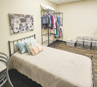  Healing Haven features several living and work environments at its campus, such as this model bedroom where students can perform tasks such as  making the bed and putting away clothes.  