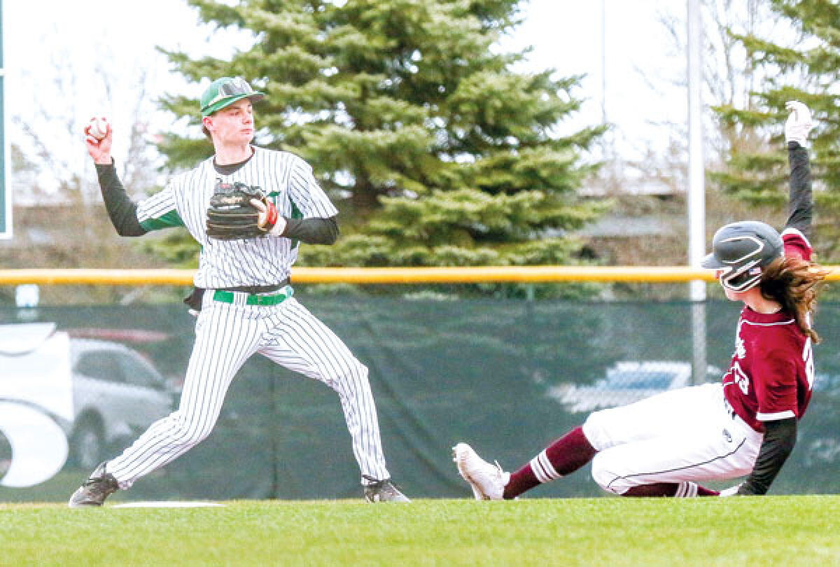  Novi junior Keegan Litkewycz makes the throw to first in an attempt to turn a double play. 