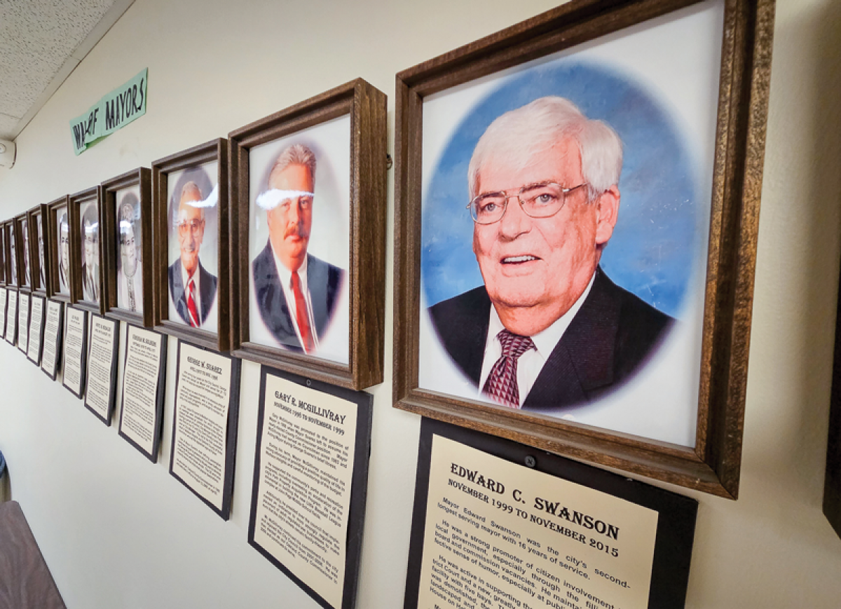  Portraits of Madison Heights city officials past and present line the walls of City Hall. The former mayor, Ed Swanson, and former council members — Rich Clark, Elva Mills and Lindell Ross — will be honored this year at dedication ceremonies renaming different city venues after them. 