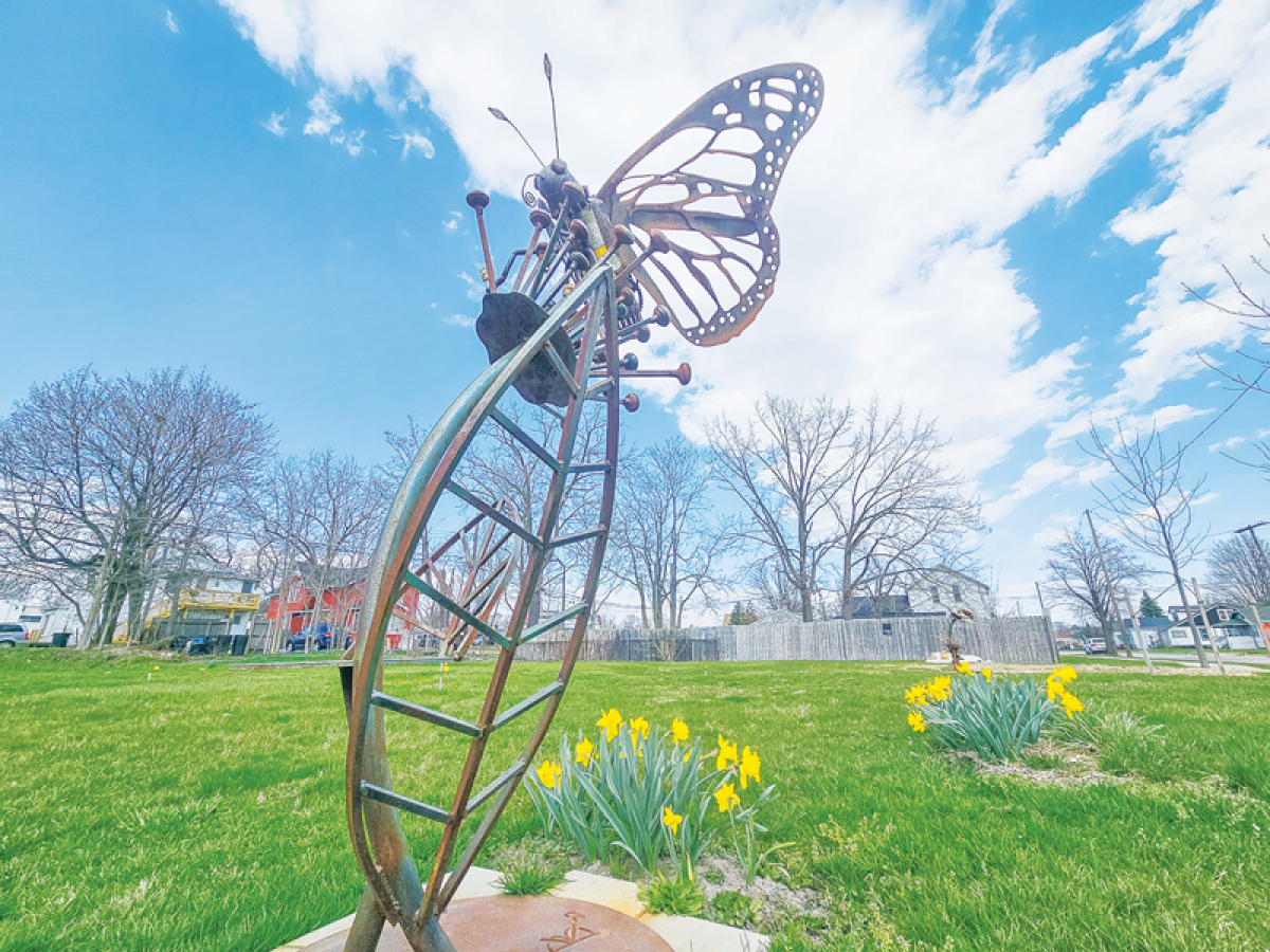  A sculpture of a butterfly invites people into the Macomb Cultural and Economic Partnership’s pollinator park, located at 17 Gratiot Ave. in Mount Clemens. 