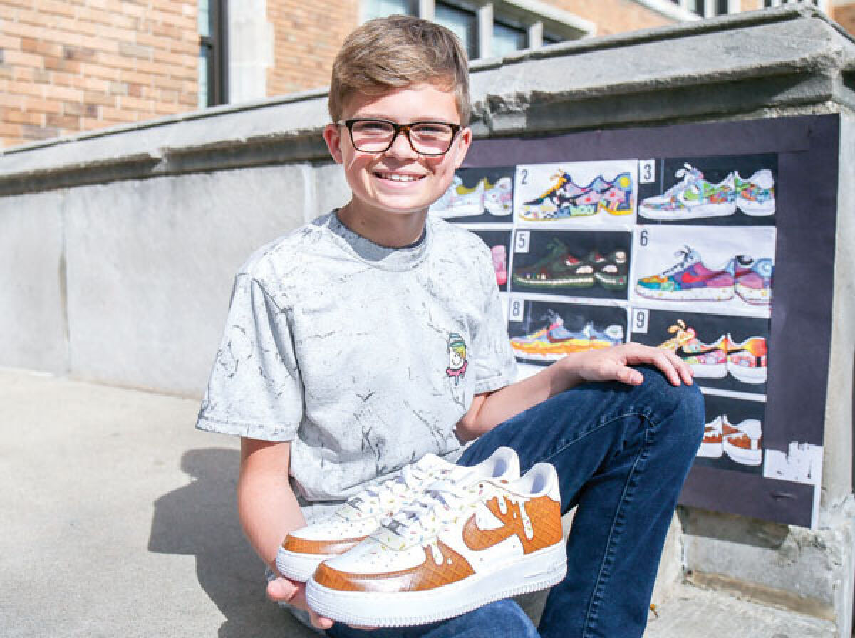  Ben Ellis poses with his customized ice cream-themed shoes, which were his prize for winning a design contest at Royal Oak Middle School. 