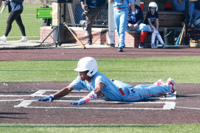  University Liggett sophomore Javion Gray slides into home. 