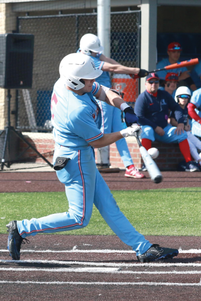  University Liggett senior Nick Greene makes contact with the ball during a matchup against Ann Arbor Greenhills on April 8 at Liggett High School. 