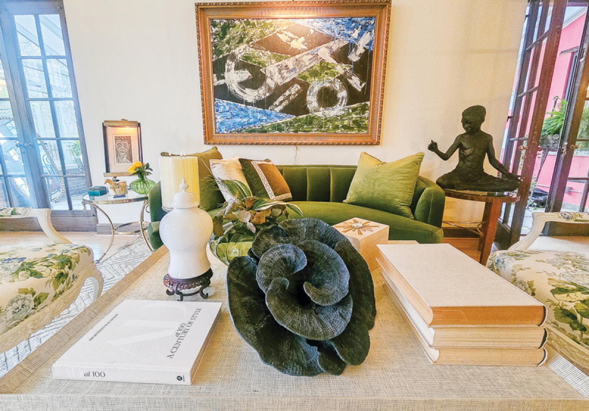  Pops of color, like olive green, stand out against the cream and off-white furniture chosen by Loretta Crenshaw, of Crenshaw & Associates, for the elegant, expansive living room.  