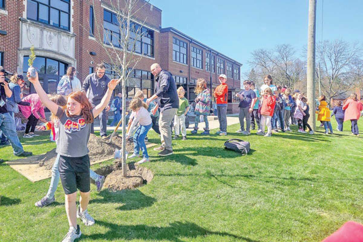  Students line up to help plant a red oak tree at Oakland Elementary’s 100th anniversary celebration April 19. 