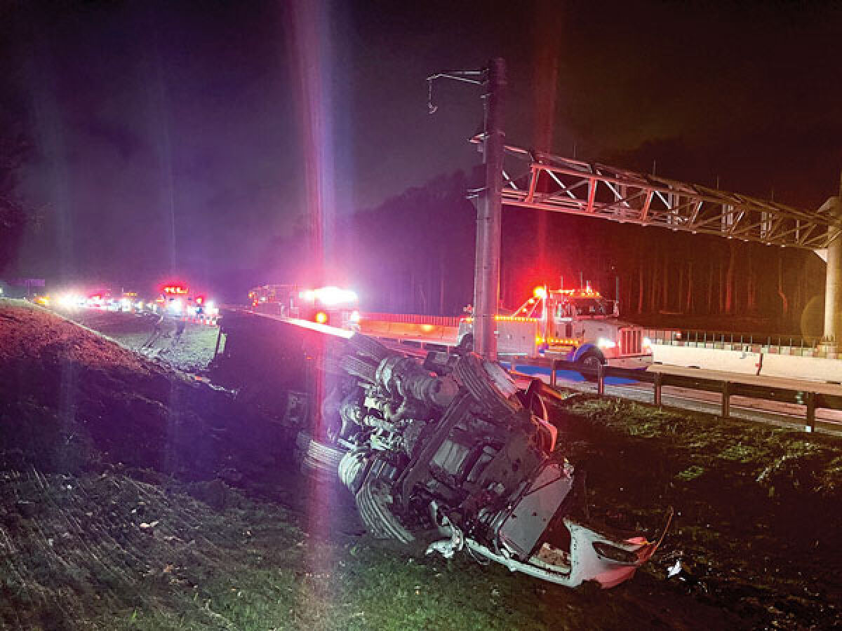  An overturned semitruck is seen in the ditch along eastbound Interstate 96 near Beck Road as emergency services come to evaluate the situation April 18. 