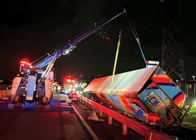  Hadley’s Towing utilizes a rotator truck, along with some heavy-duty wreckers, to turn the overturned semitruck upright. 