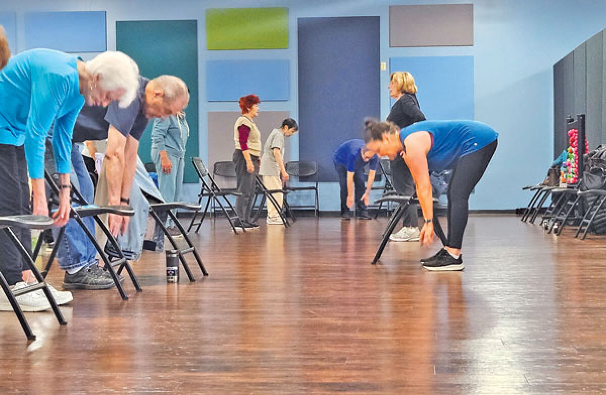  Instructor Gayle Taub and volunteer Thea Sailer lead a stretch and tone class at the Connect Senior Center in West Bloomfield April 30. 
