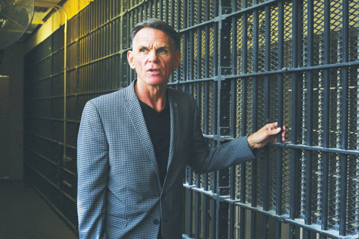  Macomb County Executive Mark Hackel, who previously served as Macomb County’s elected sheriff, guides the media through the jail’s decommissioned maximum security block. 
