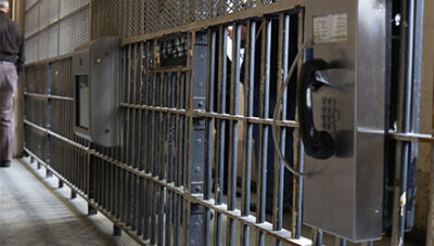  A telephone and video calling device are attached to the inmate-facing side of the catwalk in the Macomb County Jail’s decommissioned old maximum security block. 