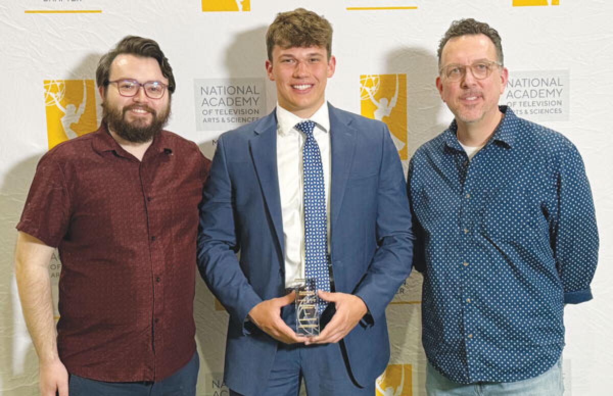  Sam Klonke, middle, with his Royal Oak Schools co-op supervisor, Jaret Grisamer, left, and his film production teacher, Mike Conrad, right, attends the National Academy of Television Arts and Sciences award ceremony April 28. 