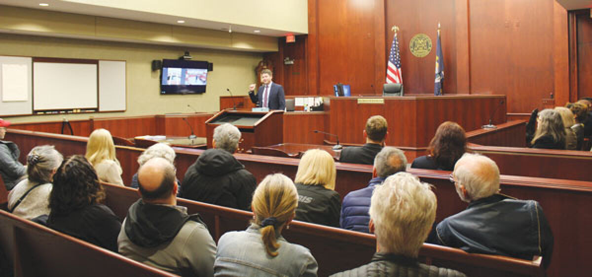  Judge Derek Meinecke and Judge Andrew Kowalkowski speak to attendees about the initiatives and programs in place at the 44th District Court during the Justice Open House event April 24. 