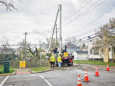  Crews work to clear a downed tree at Paxton and Saratoga streets after a windstorm April 17. 
