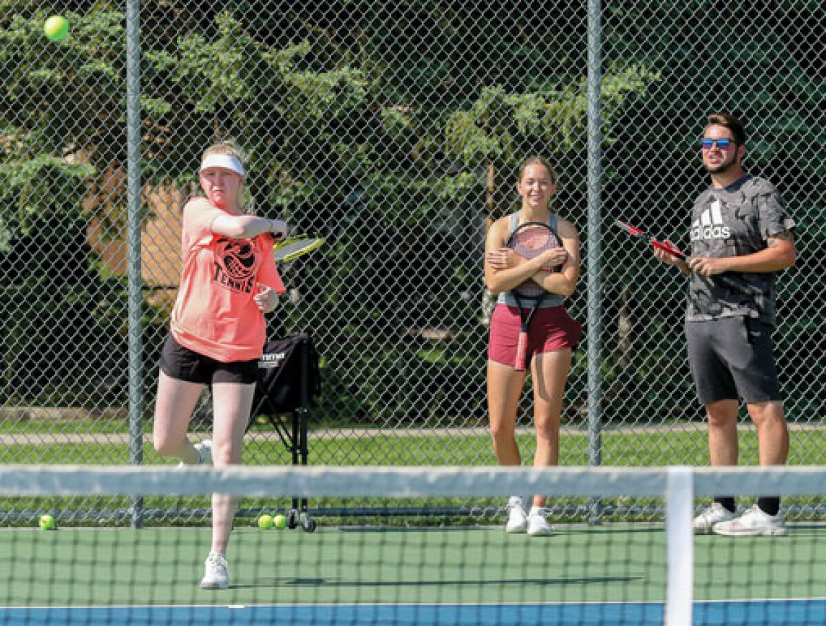  Macomb Dakota senior Ashley Gottschling returns the ball during a team practice. 