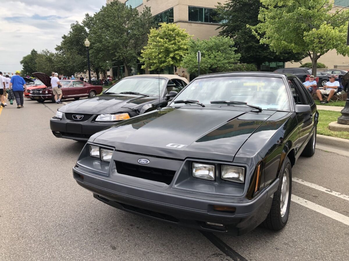  A 1985 Ford Mustang GT with a T-top owned by Livonia resident Neil Murawski sits inside Mustang Alley alongside many others at Ferndale’s Woodward Dream Cruise event Aug. 20. 