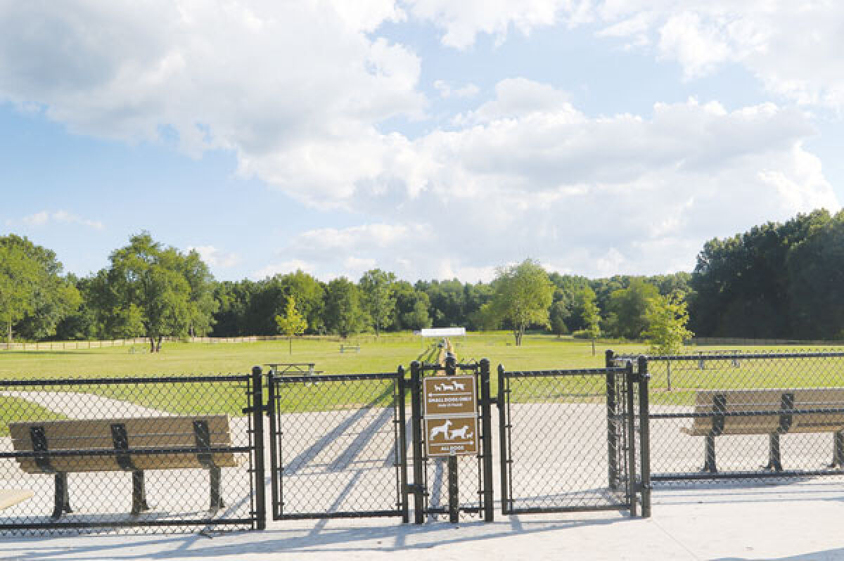  An off-leash dog space, with an area for smaller dogs on the left and an area for larger dogs on the right, recently opened in the Oak Grove picnic area at Stony Creek Metropark. 
