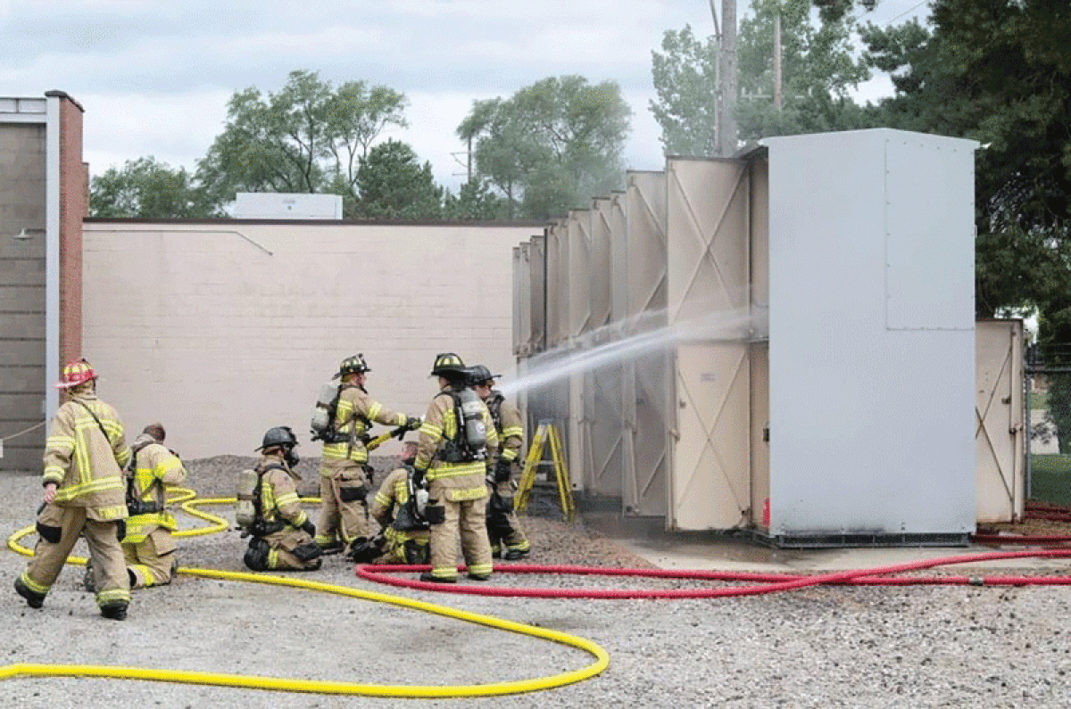  Firefighters from Royal Oak help extinguish any remaining fire at the DTE Energy substation on Stephenson Highway, south of 12 Mile Road, Aug. 8.  