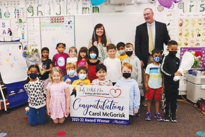  Carol McGorisk, a kindergarten teacher at Longview Elementary School, stands with her class after winning the award. 