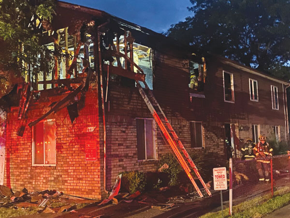  Eastpointe firefighters work at the scene of a fire Aug. 14 at an apartment complex located at 10 Mile Road and Dodge Street. 