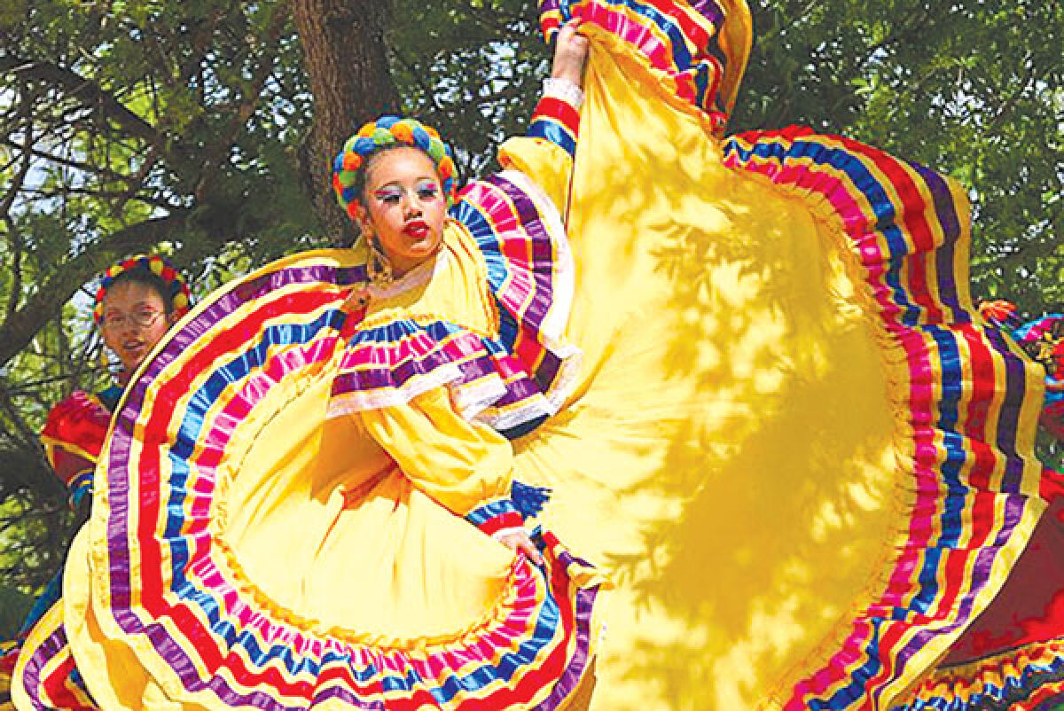  A dancer performs ballet folklorico, a Mexican style of dance. Three different dance companies will perform this type of dance during the event. 