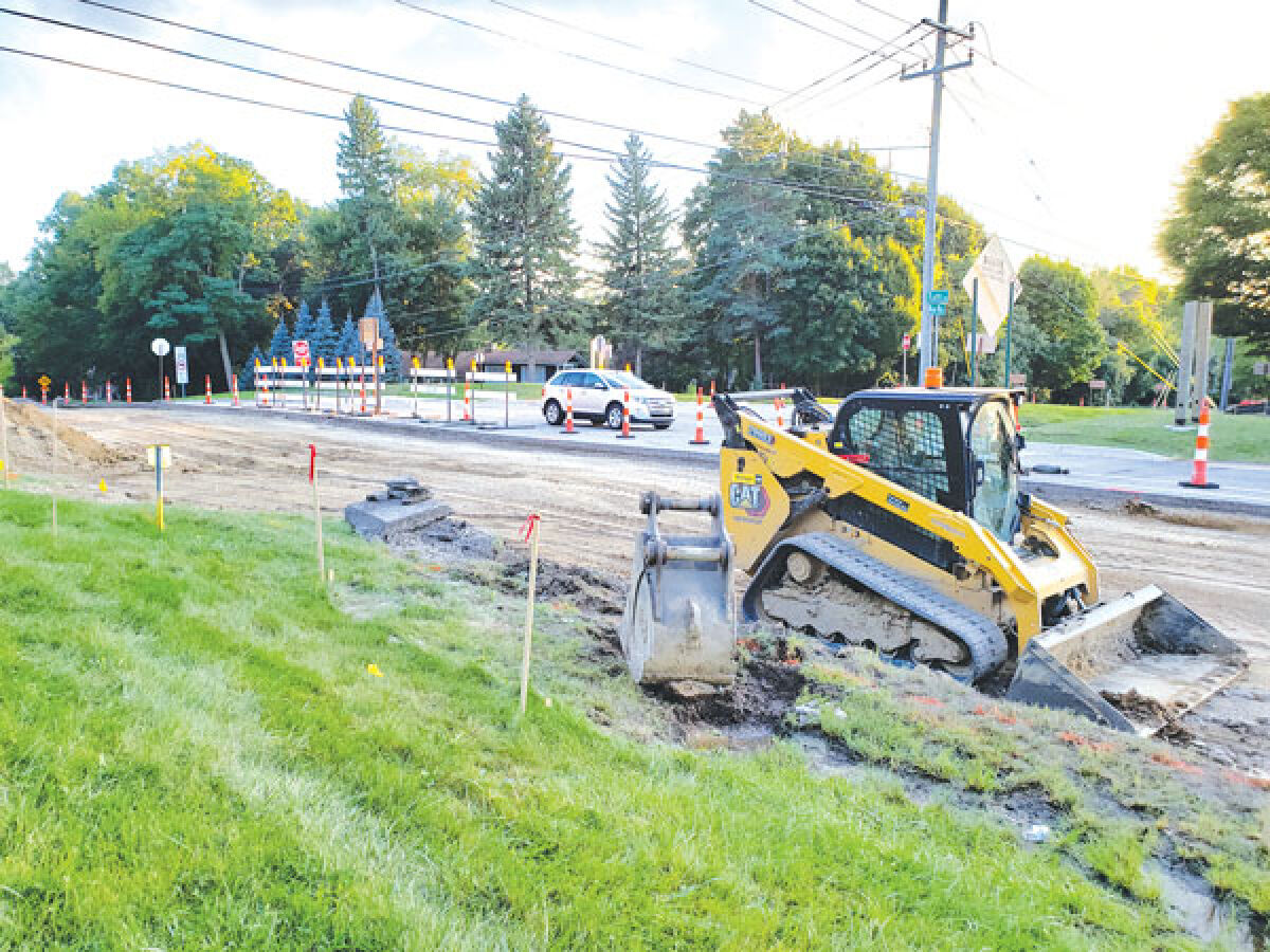  A car drives on Taft Road at Nine Mile Road Aug. 22 as construction for a new roundabout at that intersection is underway. 