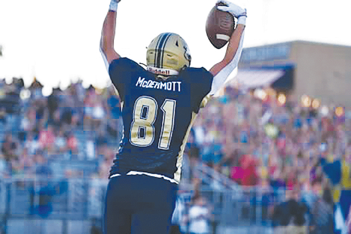  Stoney Creek’s offense celebrates with senior running back Jon Fogler  during one of his three touchdowns on the night.  