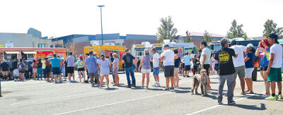  Attendees line up for food at Novi Taco Fest. 