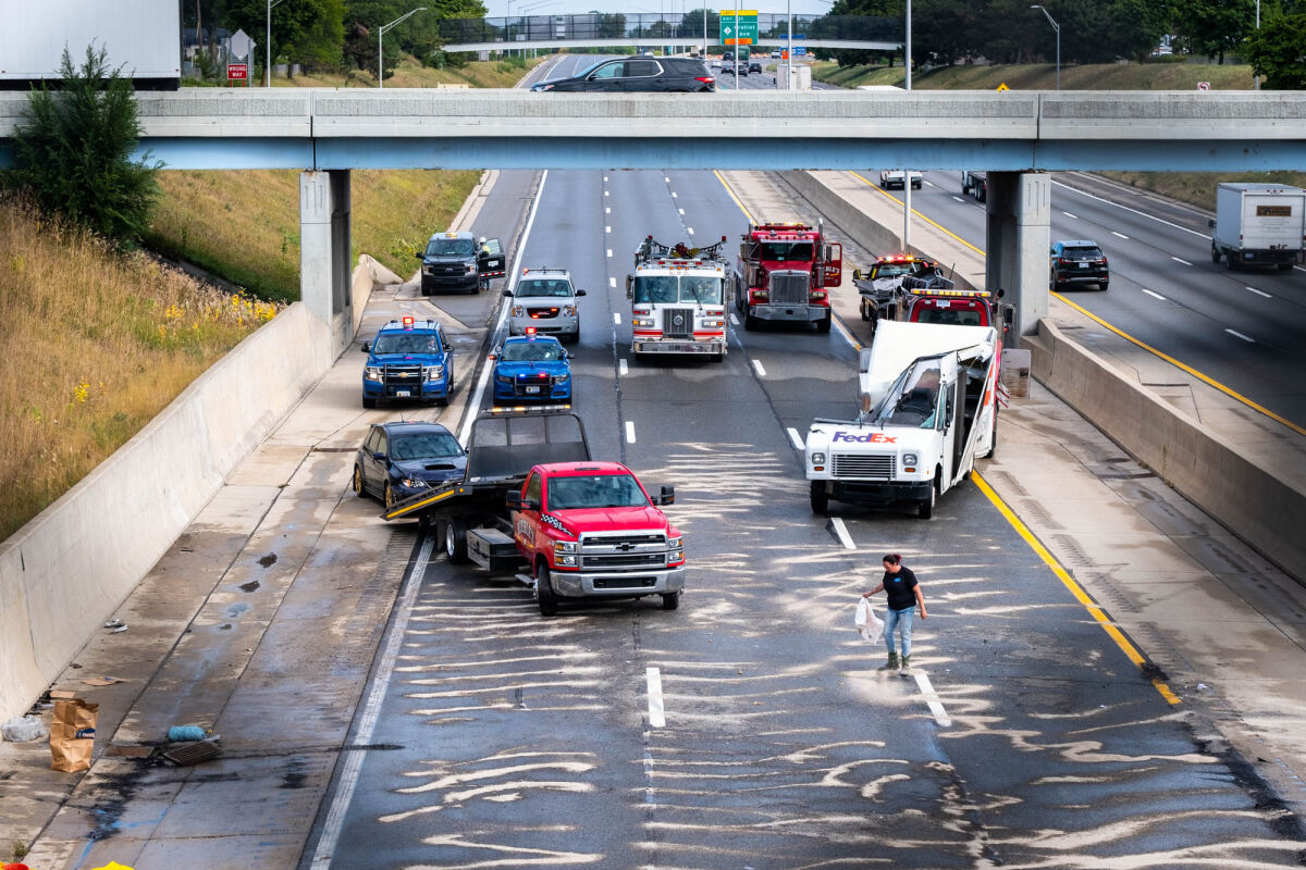  Emergency crews work to clean up westbound Interstate 94 after a crash caused it to close Tuesday, Sept. 13, in Roseville. 
