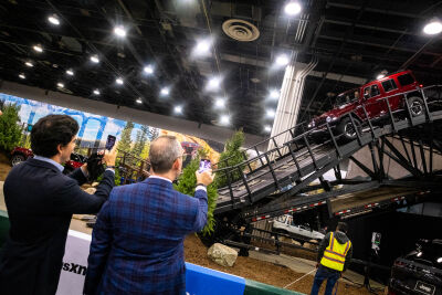  People watch as a Jeep Wrangler variant descends a manufactured hill as part of a demonstration at the Detroit Auto Show Sept. 14. 