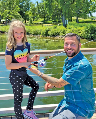  Aside from hosting an outdoor adventure show, McKinstry also volunteers to help children fish at camps hosted by West Bloomfield. 