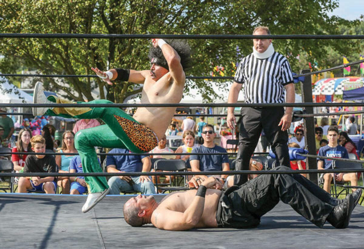  D-Ray 3000 slams down on a competitor during one of the wrestling matches put on by the North West Championship Wrestling league. The 52nd annual Troy Daze celebration featured four days of wrestling matches followed by a Battle Royale. 