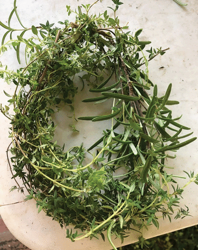  Thyme is woven into a wreath, which, on a smaller scale, can be used for seasoning  a soup in the winter. 