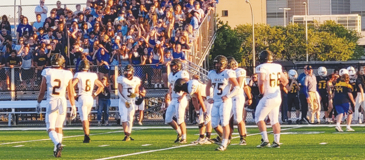  Bishop Foley seniors Jack Hopkins, right, and Logan Renner, left, impose their will on the defensive line against Royal Oak Shrine Catholic High School on Sept. 9. 