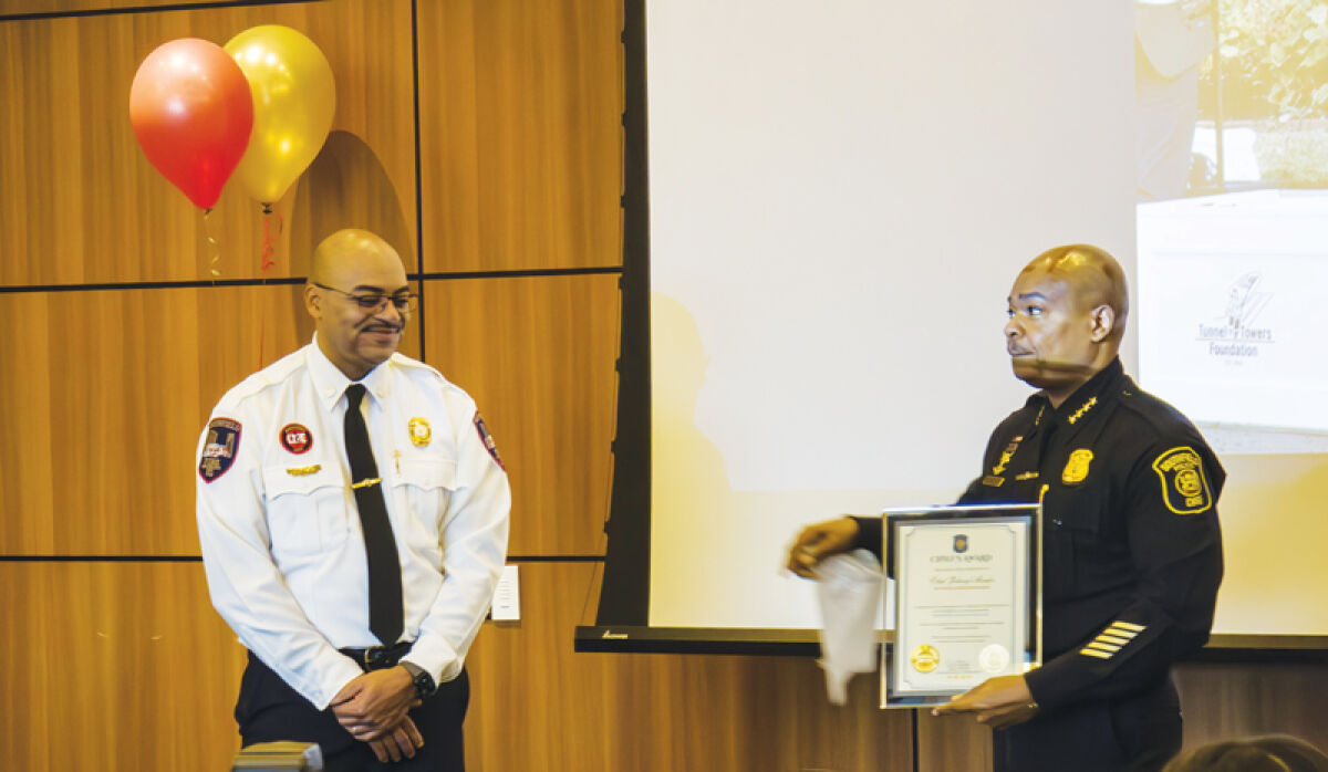  At a retirement party for Southfield Fire Department Chief Johnny Menifee, Southfield Police Department Chief Elvin Barren presented him with a Chief’s Award, recognizing him for his dedication to selflessly serving the community. 