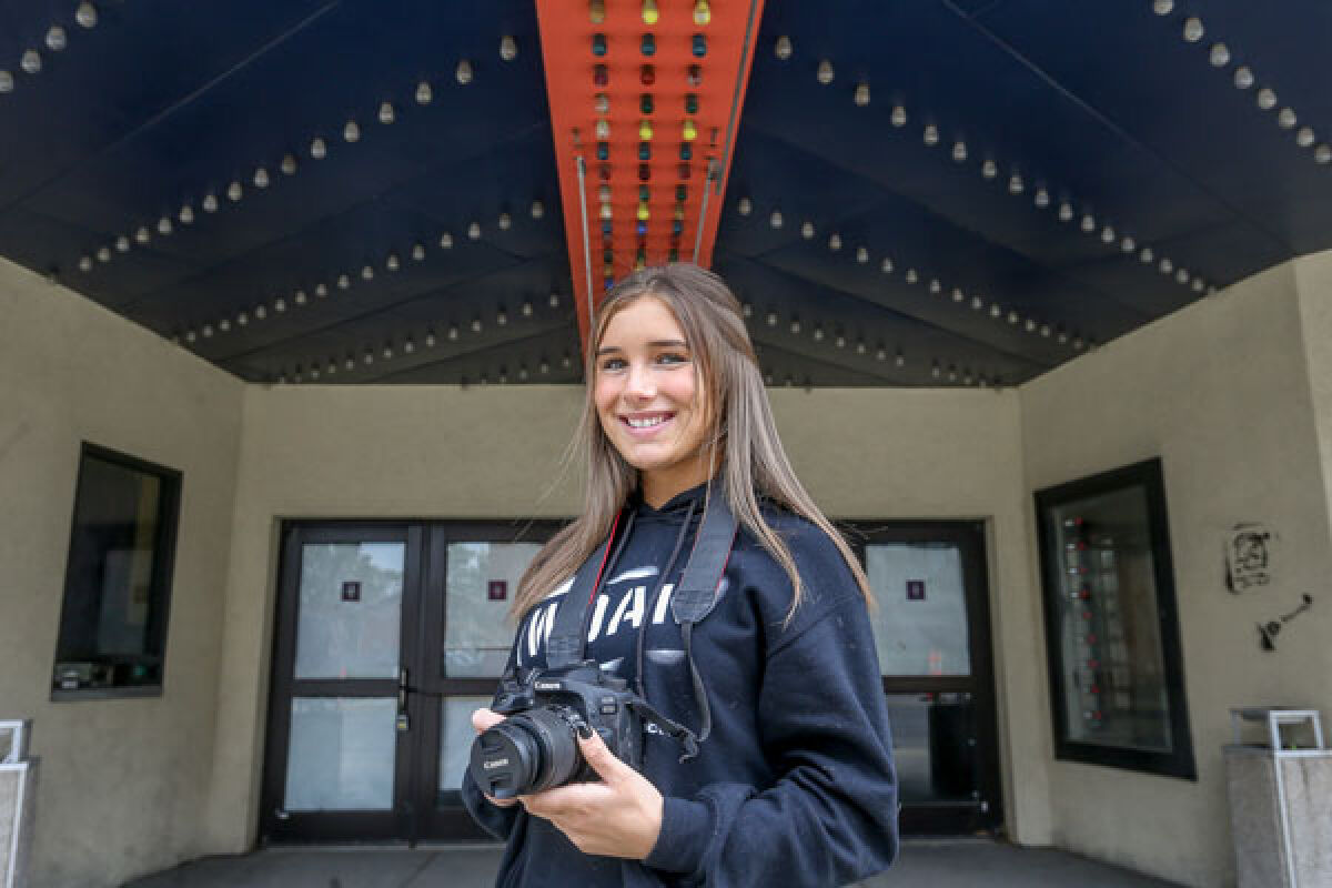  Royal Oak High School junior Farrah Ardwin stands with her camera in front of the shuttered Main Art Theatre June 5. Ardwin won a best-in-show award from the Michigan Student Film Festival for her documentary about teen vaping. 