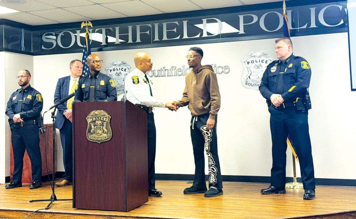  Southfield Police Department Chief Elvin Barren presents the victim of a carjacking, Joshua, with the Chief’s Award for his bravery and courageous efforts, which aided in catching the suspects. Pictured from left are Southfield Police Department Lt. Mostapha J. Bzeih; Justin Davis, the chief of policy and training for the Oakland County Prosecutor’s Office; Southfield Police Department Deputy Chief Aaron Huguley; Barren; Joshua; and Southfield Police Department Deputy Chief Jeffrey Jagielski. 