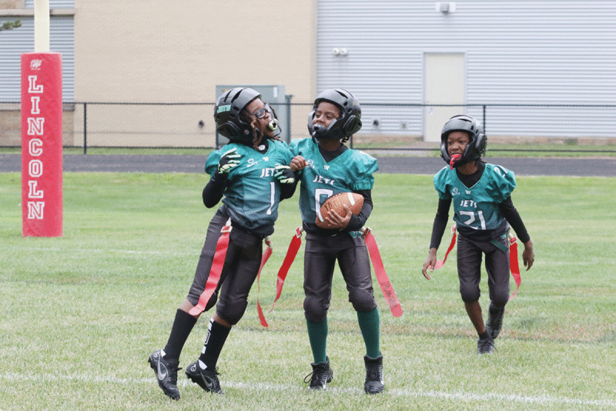  Warren Jets players celebrate as they cruise to a 27-0 win over the St. Clair Shores Green Hornets on Sept. 24 at Warren Lincoln High School. 