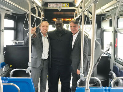  Oakland County Executive David Coulter, left, and Macomb County Executive Mark Hackel, right, rode SMART’s new all-electric bus driven by Michael Youngblood, the master trainer at SMART’s Oakland Terminal, center. 