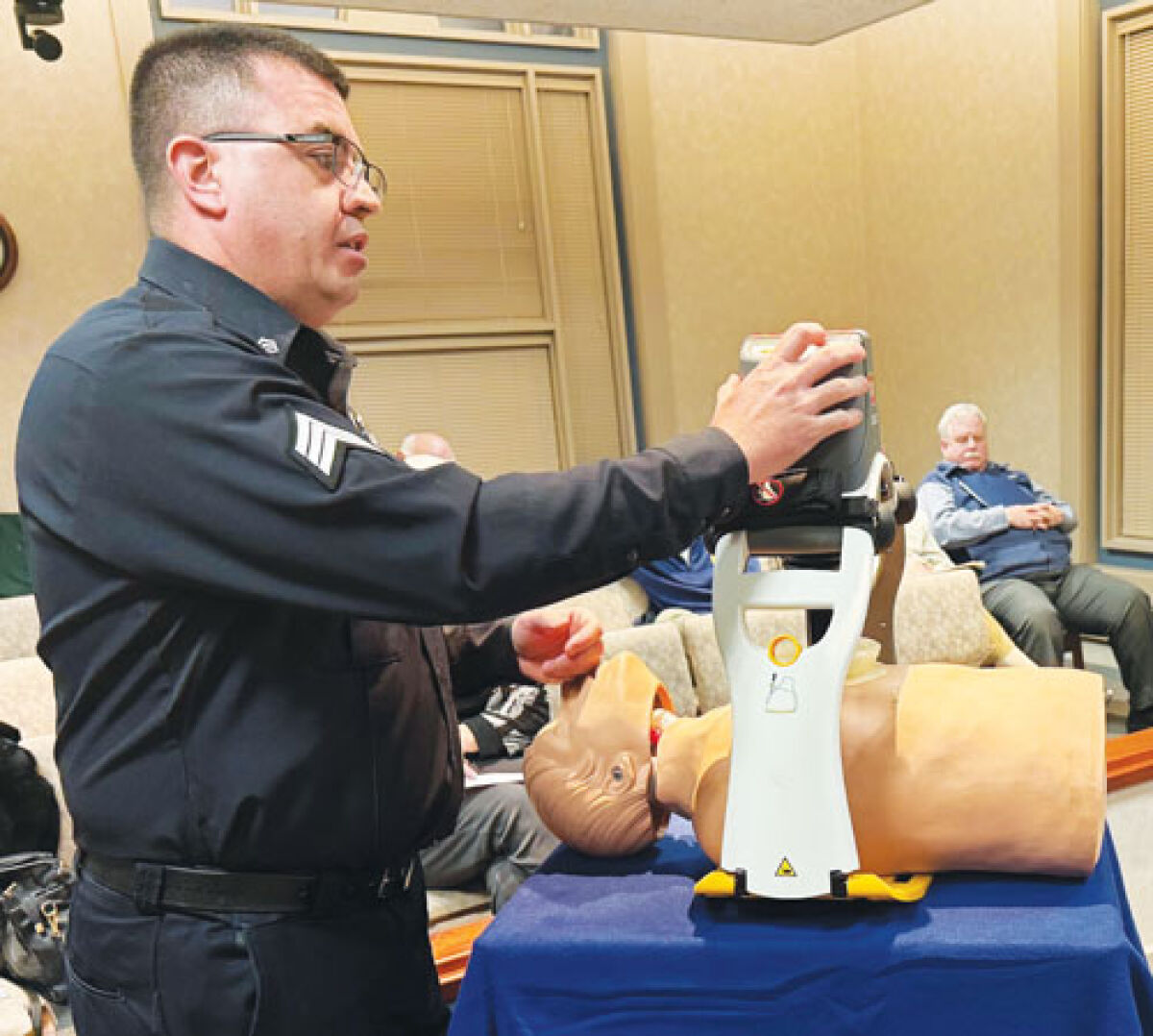  Grosse Pointe Shores Public Safety Sgt. Jason Cook explains to the Shores City Council how the LUCAS device works during a medical emergency requiring CPR. 