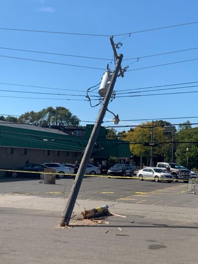  An electrical pole leans in the Hollywood Markets parking lot off North Main Street in Royal Oak during the afternoon Oct. 3 after a truck backed into it and knocked out its base. 