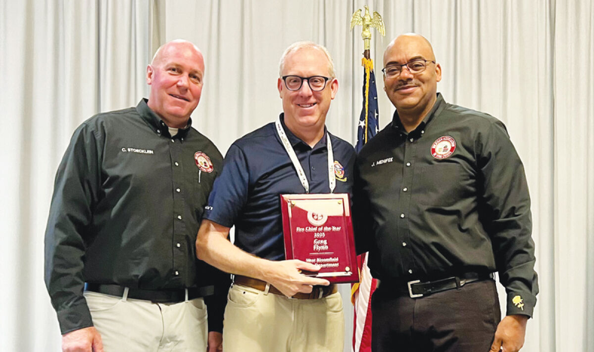  West Bloomfield Fire Chief Greg Flynn, center, was named the 2025 Fire Chief of the Year by the Michigan Association of Fire Chiefs at the Midwest Fire Rescue Expo. He is flanked by MAFC Board of Directors Vice President Chris Stoecklein, left, and President Johnny Menifee. The two men are fire chiefs at the Canton Township and Southfield fire departments, respectively. Menifee recently retired. 